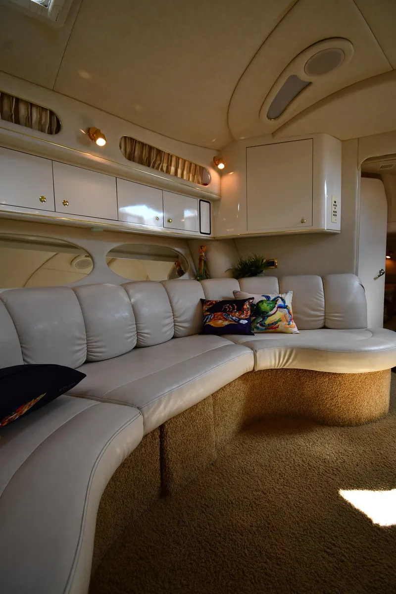 Slide: The Image of Luxurious interior of a 1997 Sea Ray 400 Sundancer yacht with plush seating. - 46