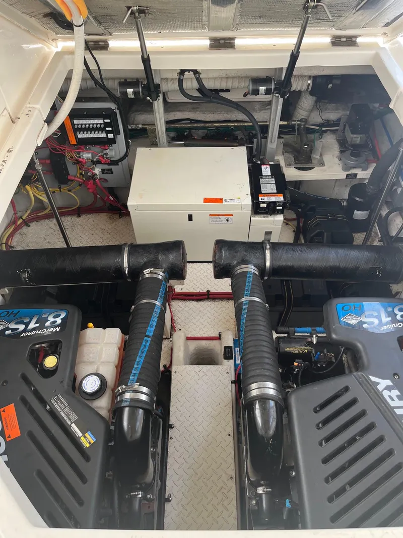 Slide: The Image of Engine room of 2003 Cruisers Yachts 400 Express with dual engines and equipment. - 17