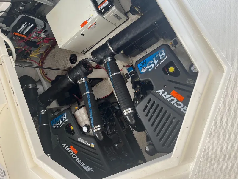 Slide: The Image of Engine compartment of 2003 Cruisers Yachts 400 Express with Mercury 8.1S motors. - 18