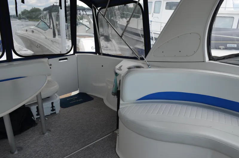 Slide: The Image of Interior of 2007 Bayliner 325 Sunbridge boat with seating and windows. - 13
