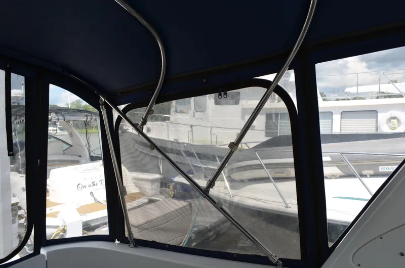 Slide: The Image of Interior view of 2007 Bayliner 325 Sunbridge with marina background. - 17