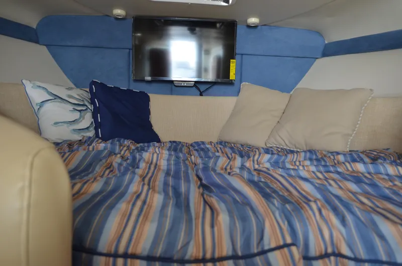 Slide: The Image of Interior cabin of 2007 Bayliner 325 Sunbridge with bed and TV. - 27
