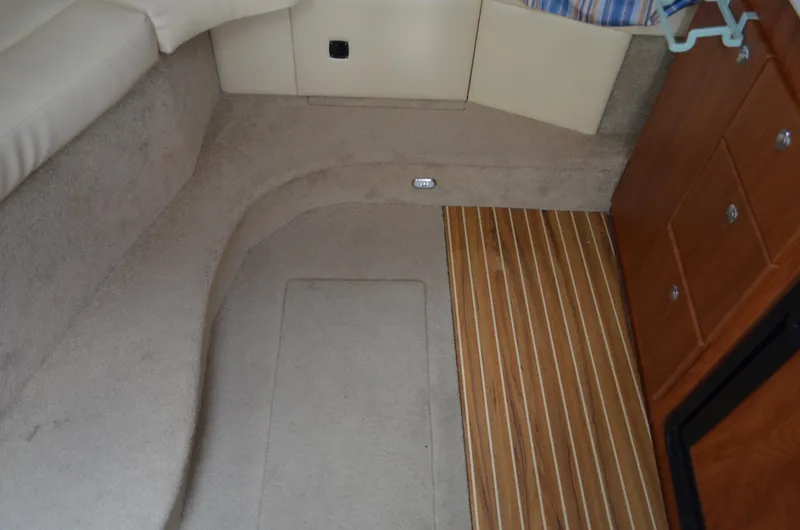 Slide: The Image of Interior of 2007 Bayliner 325 Sunbridge with carpet and wood flooring. - 28
