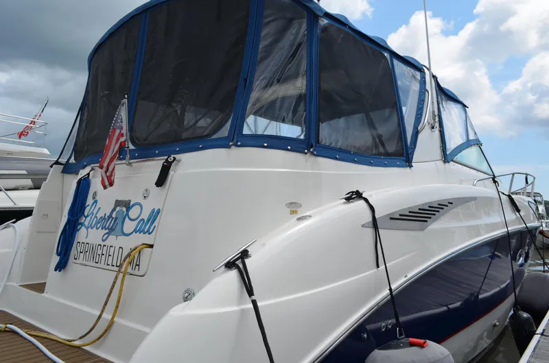 Slide: The Image of 2007 Bayliner 325 Sunbridge boat docked, featuring blue canopy and Springfield, MA registration. - 3
