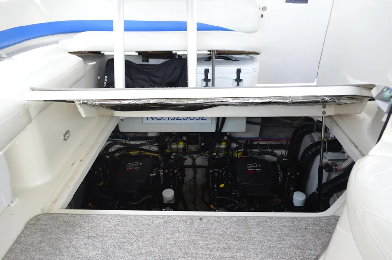 Slide: The Image of 2007 Bayliner 325 Sunbridge engine compartment with dual engines visible. - 39