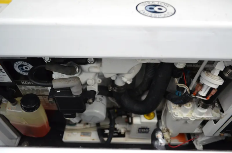 Slide: The Image of Engine compartment of a 2007 Bayliner 325 Sunbridge boat, showcasing mechanical components. - 44