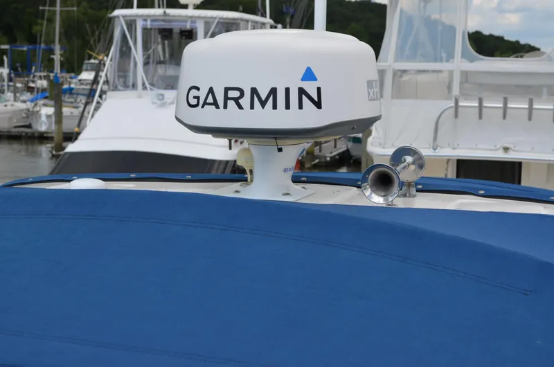 Slide: The Image of 2007 Bayliner 325 Sunbridge with Garmin radar, docked at marina. - 9