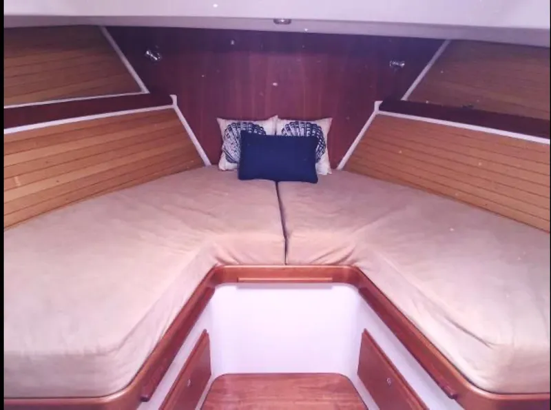 Slide: The Image of Luxurious cabin interior of 2007 Back Cove 33 yacht with cozy bed and seating area. - 11