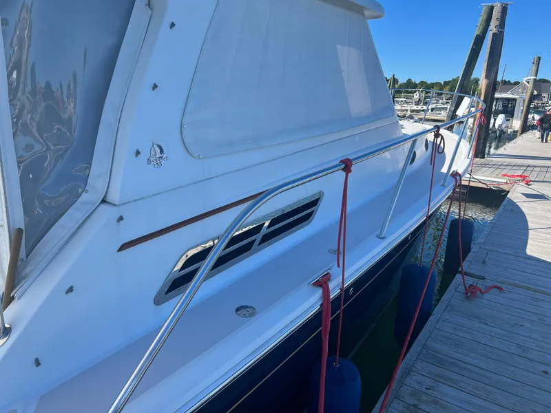 Slide: The Image of Electrical control panel on a 2007 Back Cove 33 boat, featuring various switches and displays. - 21