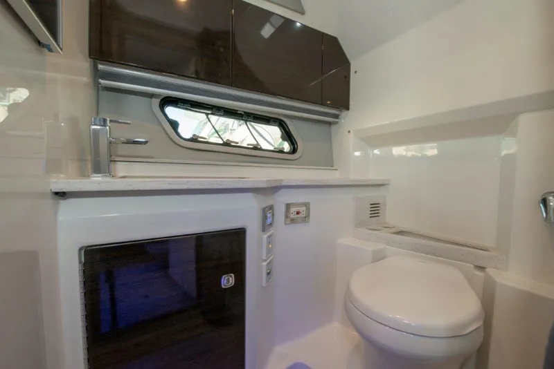 Slide: The Image of 2019 Formula 400 Super Sport Crossover bathroom interior with modern fixtures and window. - 10
