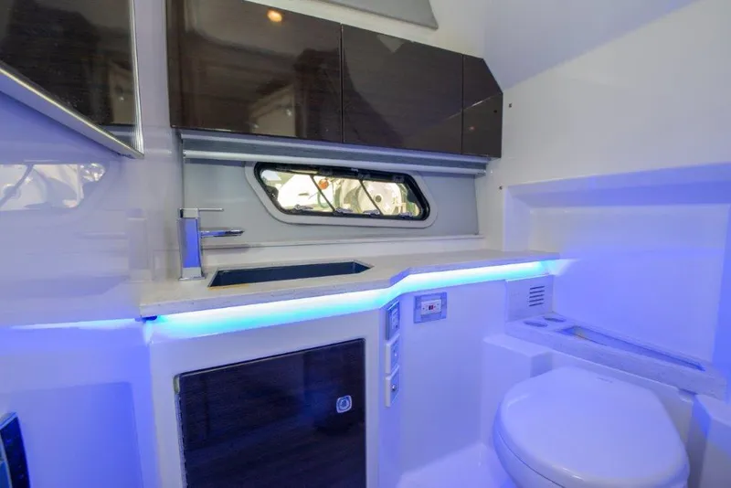 Slide: The Image of 2019 Formula 400 Super Sport Crossover bathroom with modern fixtures and ambient lighting. - 11
