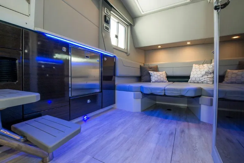 Slide: The Image of Interior of 2019 Formula 400 Super Sport Crossover with modern seating and ambient lighting. - 14