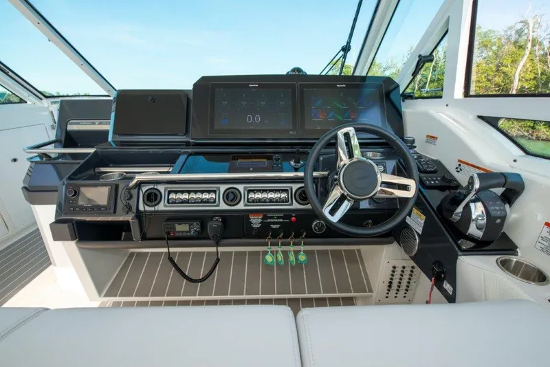 Slide: The Image of 2019 Formula 400 Super Sport Crossover helm with modern controls and navigation screens. - 15