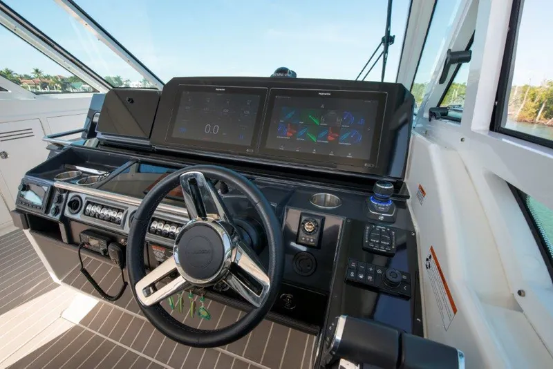 Slide: The Image of 2019 Formula 400 Super Sport Crossover helm with advanced navigation displays. - 16