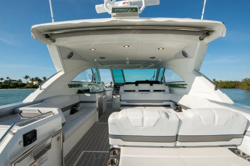 Slide: The Image of 2019 Formula 400 Super Sport Crossover yacht interior with luxurious seating and modern design. - 19
