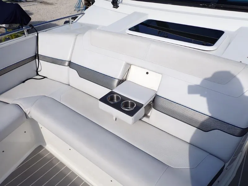 Slide: The Image of 2019 Formula 400 Super Sport Crossover boat interior with white seating and cup holders. - 21