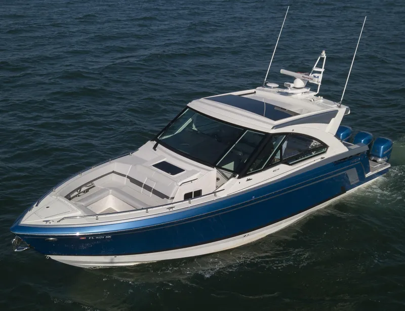 Slide: The Image of 2019 Formula 400 Super Sport Crossover boat cruising on open water. - 5