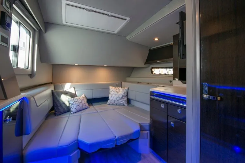 Slide: The Image of 2019 Formula 400 Super Sport Crossover interior with modern seating and ambient lighting. - 8