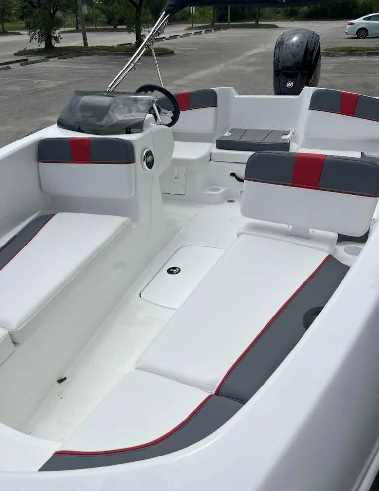Slide: The Image of 2024 Tahoe T16 boat with sleek white and gray interior, red accents, and modern design. - 3