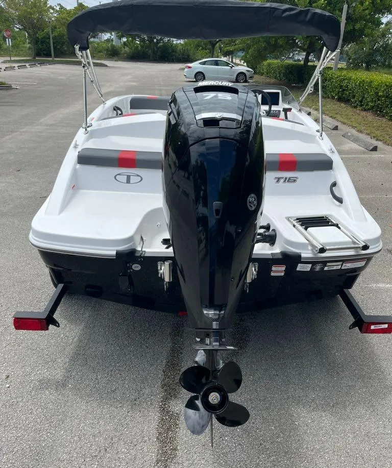 Slide: The Image of 2024 Tahoe T16 boat with outboard motor in parking lot. - 5