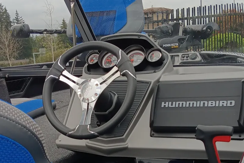 Slide: The Image of 2024 Ranger 1880MS boat dashboard with steering wheel and Humminbird electronics. - 3