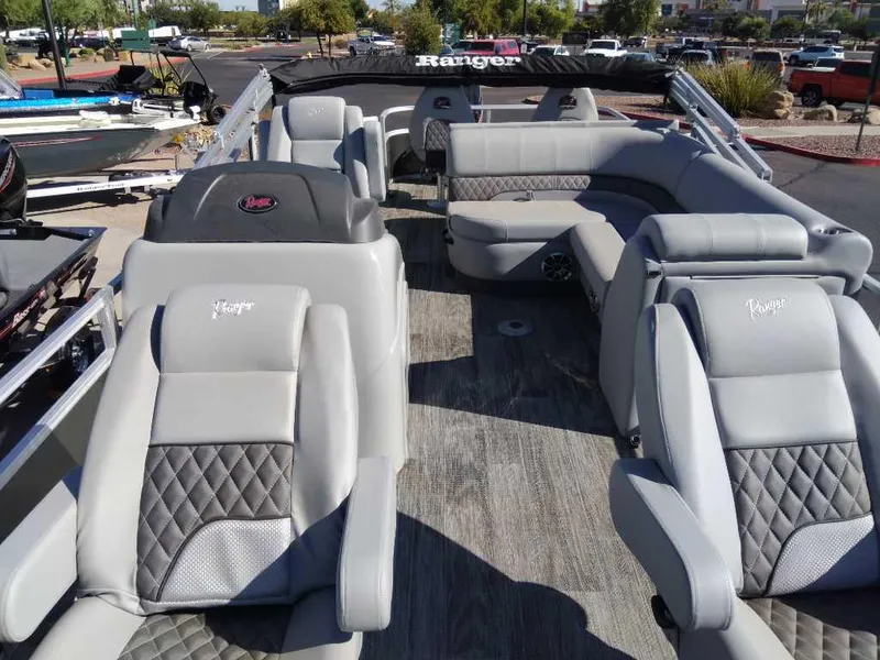 Slide: The Image of 2024 Ranger Reata 220F boat interior with plush seating and modern design. - 3