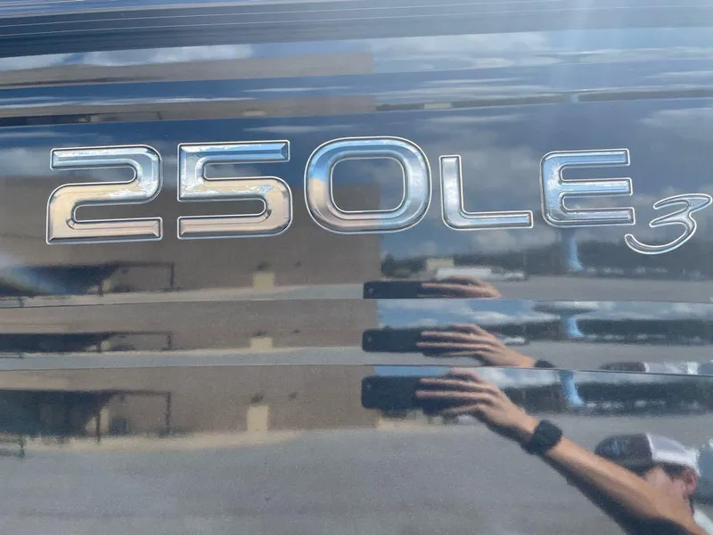 Slide: The Image of 2024 Regency 250 LE3 logo on reflective surface. - 2