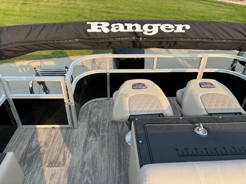 Slide: The Image of 2024 Ranger Reata 223FC boat interior with seating and deck view. - 12