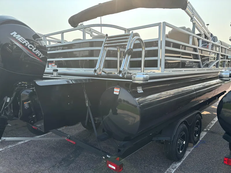 Slide: The Image of 2024 Ranger Reata 223FC pontoon boat with Mercury engine, parked on a trailer. - 3