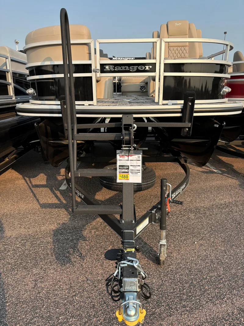Slide: The Image of 2024 Ranger Reata 223FC pontoon boat on trailer, front view. - 4