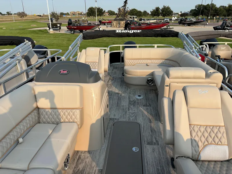 Slide: The Image of 2024 Ranger Reata 223FC pontoon boat with luxurious seating and modern design. - 8