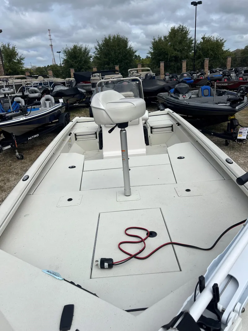 Slide: The Image of 2024 Ranger RB200 boat in a dealership lot, featuring a spacious deck and seating. - 3