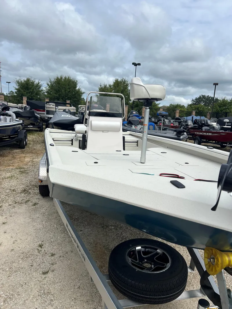 Slide: The Image of 2024 Ranger RB200 boat on trailer, outdoor display, cloudy sky background. - 4