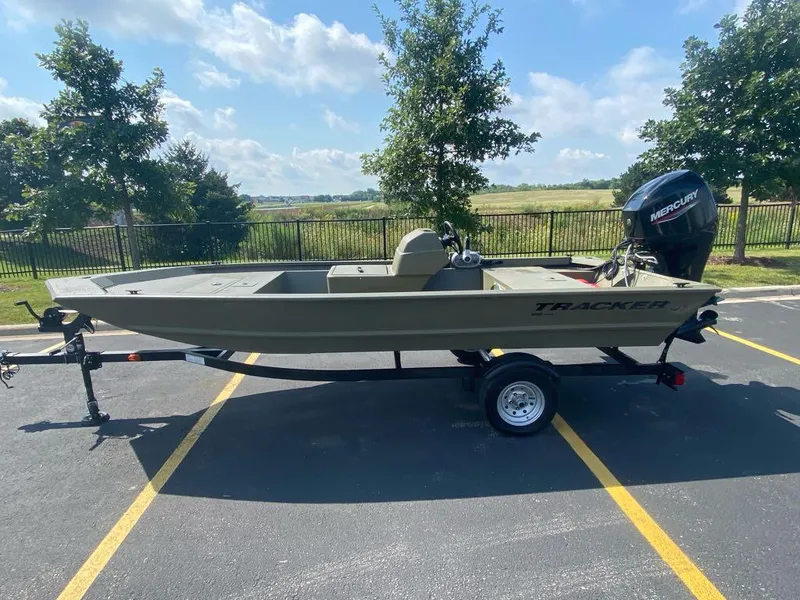 The Image of 2024 Tracker Grizzly 1648 SC boat on trailer in parking lot. - 0