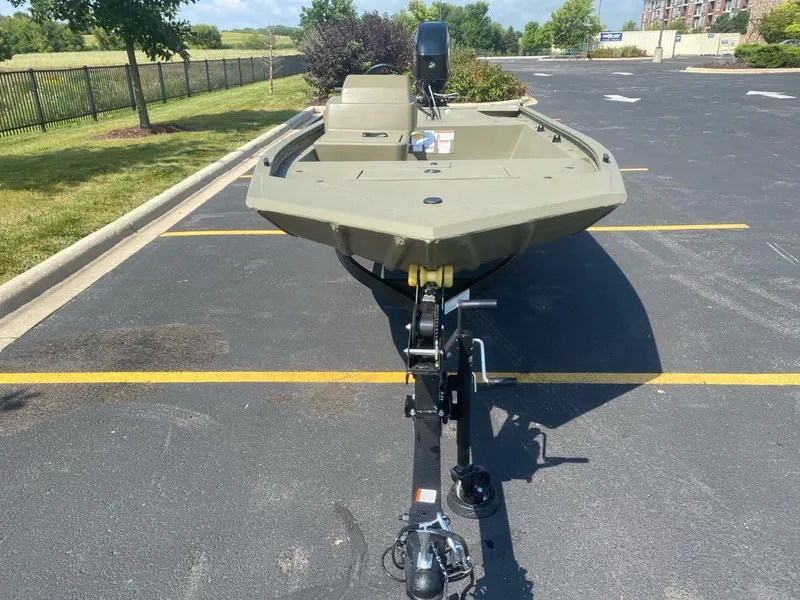 Slide: The Image of 2024 Tracker Grizzly 1648 SC boat on trailer in parking lot. - 3