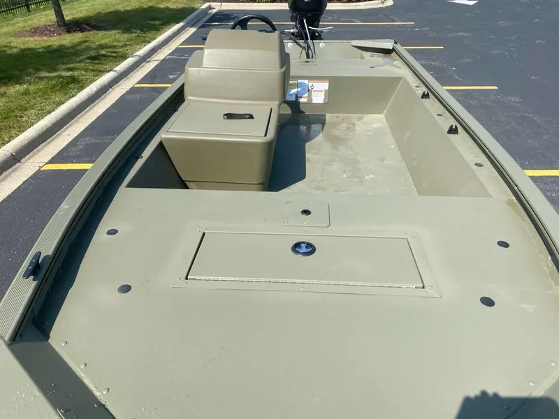 Slide: The Image of 2024 Tracker Grizzly 1648 SC boat interior, featuring spacious seating and storage compartments. - 7