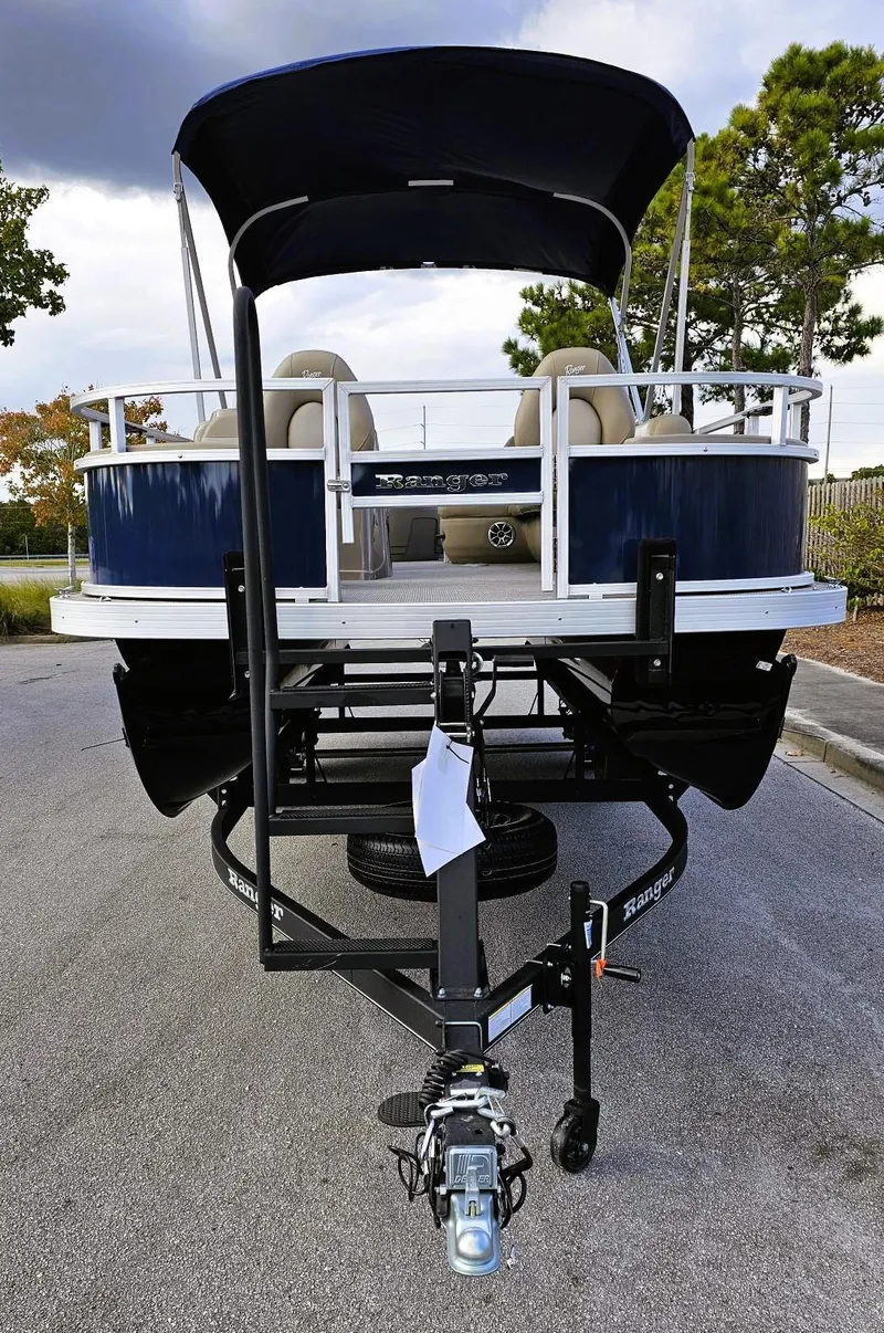 Slide: The Image of 2024 Ranger Reata 200F boat on trailer, parked outdoors. - 8