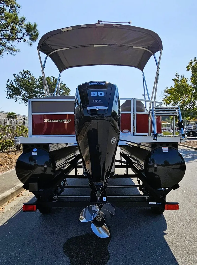 Slide: The Image of 2024 Ranger Reata 200C pontoon boat with canopy and powerful outboard motor. - 4