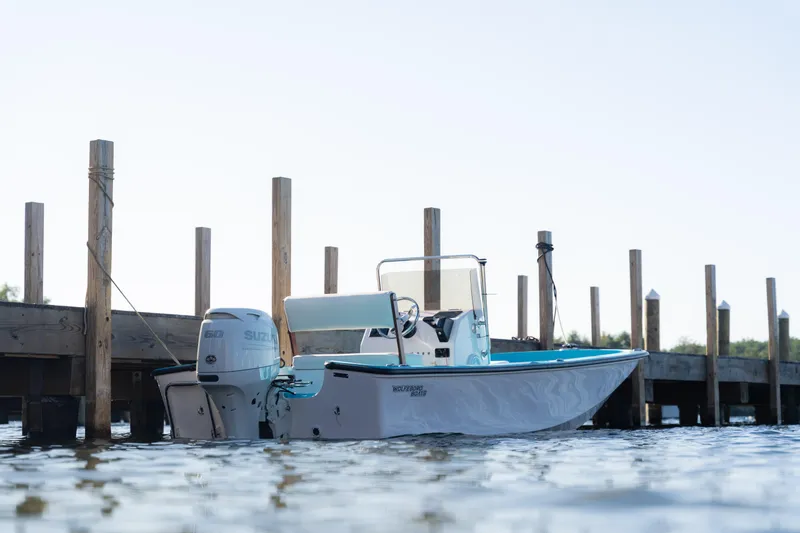 Slide: The Image of 2024 Wolfeboro Classic 15 boat docked on calm water. - 3
