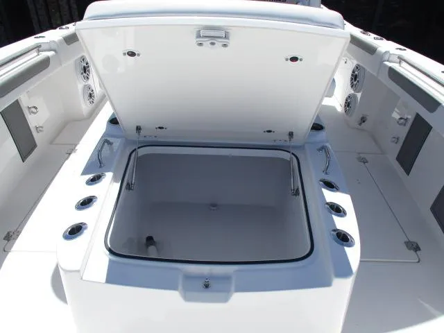 Slide: The Image of 2024 Caymas 30CAT boat with open storage compartment, showcasing spacious interior design. - 4