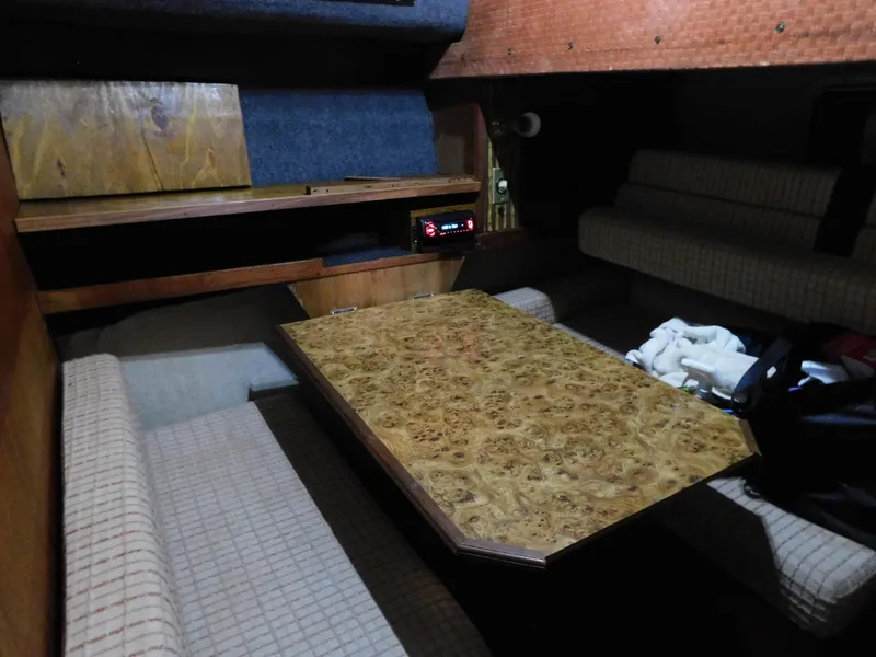 Slide: The Image of Interior of 1984 Cruisers International 296 Avanti Vee with wood table and seating. - 6