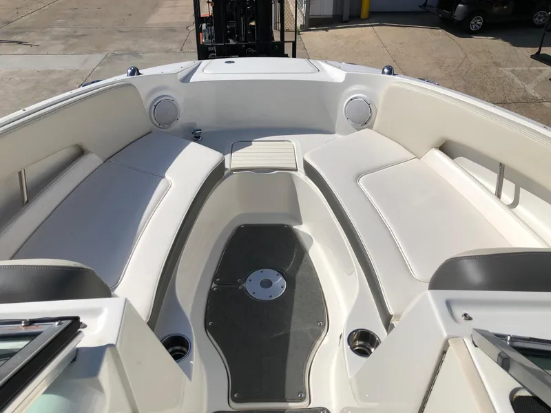 Slide: The Image of 2012 Sea Ray 240 Sundeck boat interior with spacious seating and modern design. - 11