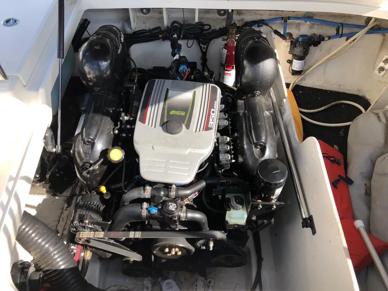 Slide: The Image of 2012 Sea Ray 240 Sundeck engine compartment with MerCruiser 350 MAG engine. - 13
