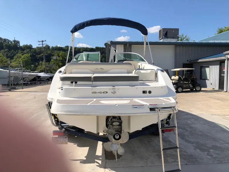 Slide: The Image of 2012 Sea Ray 240 Sundeck boat, rear view, parked outdoors. - 3
