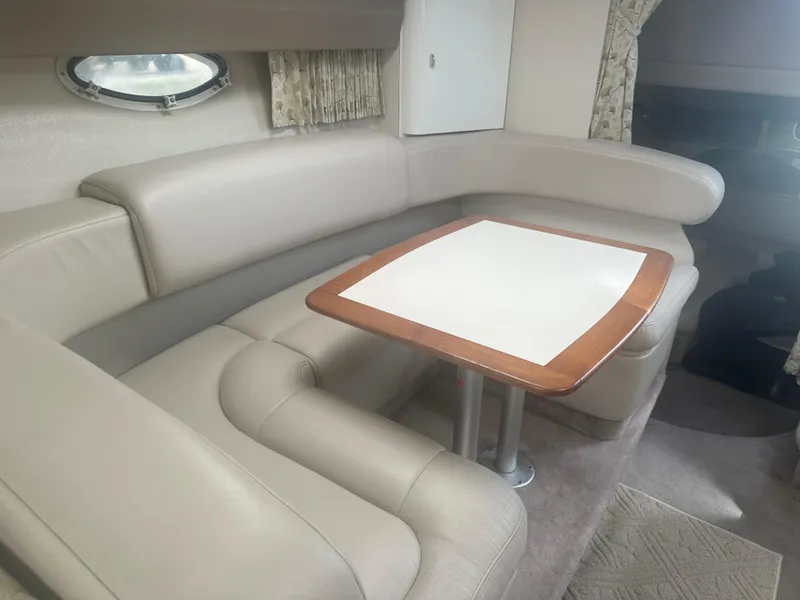 Slide: The Image of Interior of a 2000 Formula 31 Performance Cruiser with leather seating area. - 13