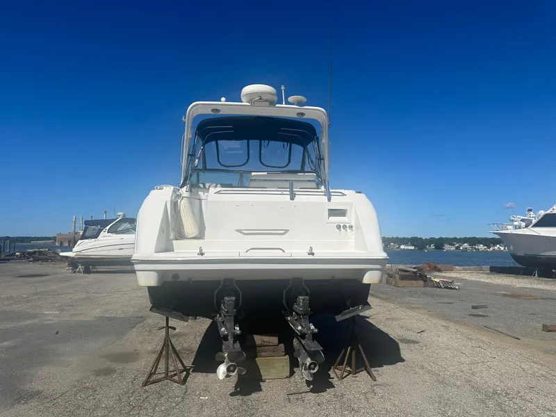 The Image of Rear view of a 2000 Formula 31 Performance Cruiser on a dry dock. - 2