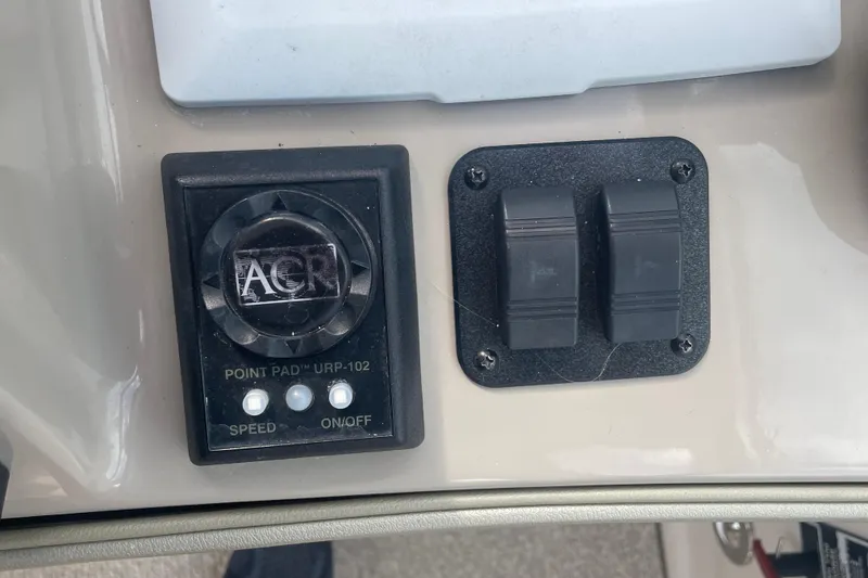 Slide: The Image of Control panel of 2009 Sea Ray 40 Sundancer boat with switches and ACR unit. - 13