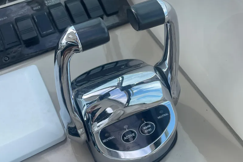 Slide: The Image of Close-up of 2009 Sea Ray 40 Sundancer throttle controls. - 16