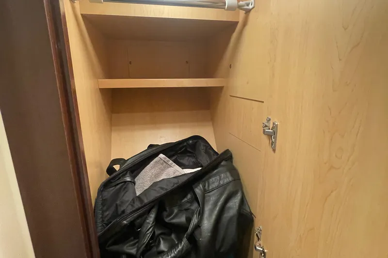 Slide: The Image of Open closet with shelves on a 2009 Sea Ray 40 Sundancer yacht. - 24