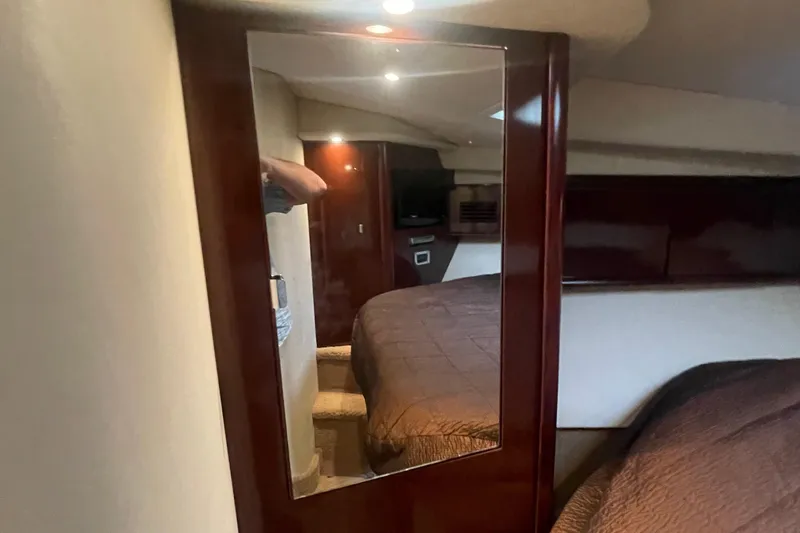 Slide: The Image of Interior of 2009 Sea Ray 40 Sundancer yacht with mirror and cozy bedroom. - 27